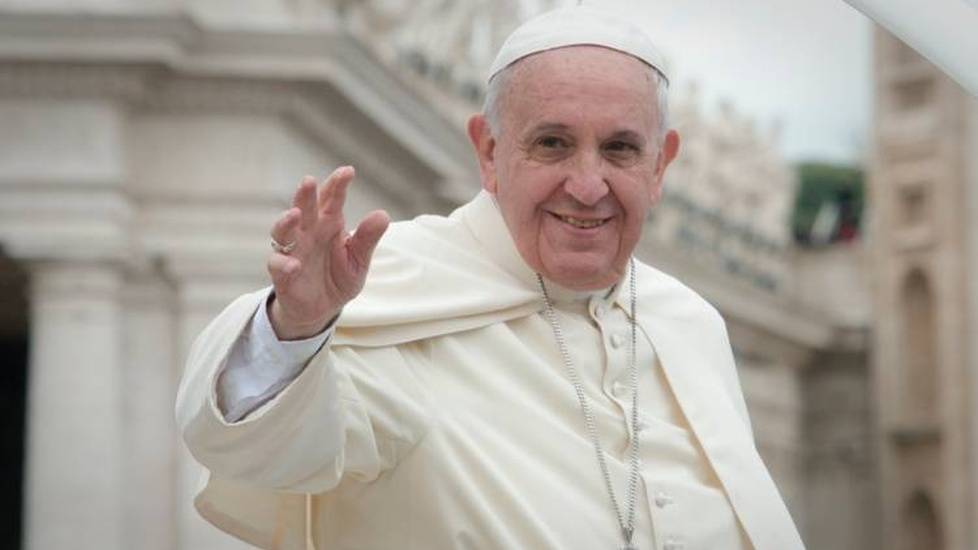 Pope Francis greeting people at the Vatican